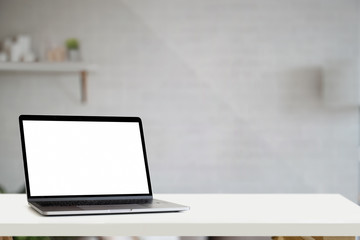Mockup blank screen laptop on white table
