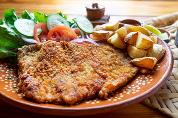 Traditional milanese beef and french fries