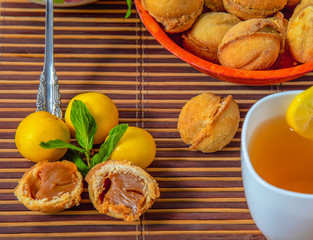 Baked nuts, with boiled condensed milk and tea with lemon.