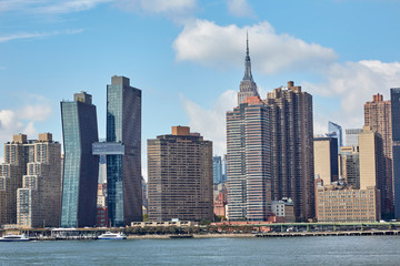 Fototapeta na wymiar Skyscrapers of New York City along the East River viewed from Long Island City, USA