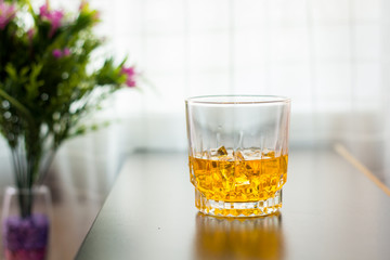 glass of whisky on the table background