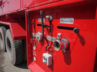 A part of fire truck. The automobile engine is all red.