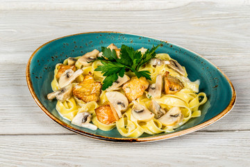 Tagliatelle pasta with forest mushrooms and chicken