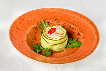 Spicy cucumber, pepper and cheese salad shot on white background