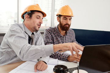 Architect showing engineer new project