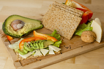 Natural and organic food on the table. Vegetarian food on a wooden board. Everyone strive for natural and quality food. The most useful products should be on the table.
