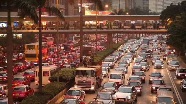 WS HA Heavy traffic on downtown freeway at dusk / Hong Kong, China