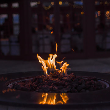 Fire in a fire pit with copy space.