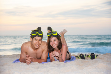 Happiness couple in romantic scene on the beach at sunset. Love and valentine concept.