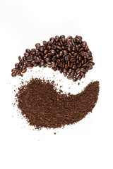 Balanced ying yang symbol of coffee beans and grounds