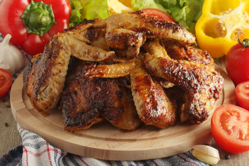 Chicken wings barbecue with different vegetables