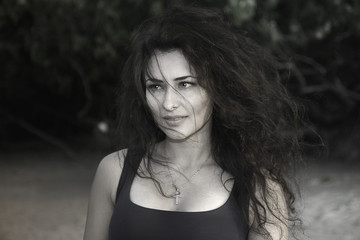 Stylish portrait of young brunette female model  with a curly hairstyle. Black and White photography.-Picture. 