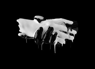 concept image of two hands covered in black and white paint touching