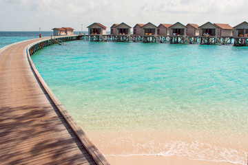 Bungalow on stilts in the water, amazing tropical nature. Maldives resort