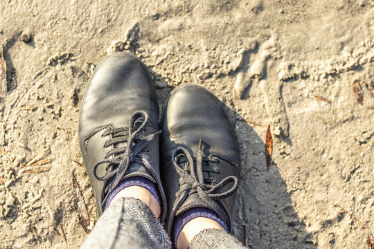 women sneakers on the legs top view - lifestyle