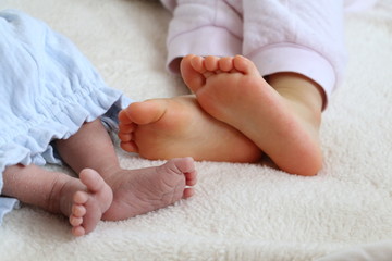 Newborn baby and child's feet