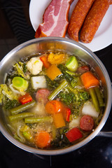 delicious autumnal vegetable soup with sausage and bacon