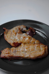 pork steak grilled with salad and tomato Shallow depth of field