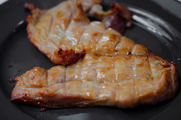 pork steak grilled with salad and tomato Shallow depth of field
