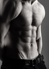 Naklejka premium Athletic caucasian, ab, six pack, chest muscles, triceps. Beautiful male torso, ab. Sexy man, naked body, nude male. Strong mans, bodybuilder, muscular men. Sexy body, nude man, naked male, muscled.