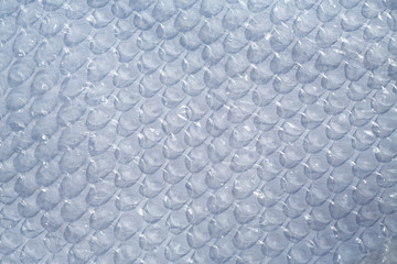 Blurred Plastic Bubble Cushioning Wrap surface texture on white background, Light & Shadow concept