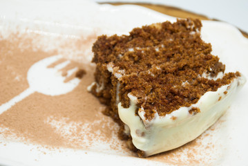 Piece of homemade chocolate cake. Rustic healthy bakery.