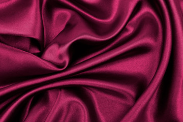 Smooth elegant pink silk or satin luxury cloth texture as abstract background. Luxurious valentines...