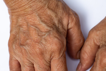 Fototapeta premium Senior woman's wrinkled skin texture of blood in back of the hand, Close up & Macro shot, Selective focus, Body part, Healthcare concept