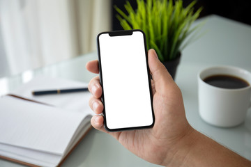 male hand holding phone with isolated screen in the office