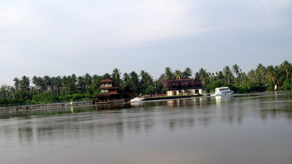 Fototapeta premium Mae Khlong River waterfront life near the famous Amphawa floating market, Thailand