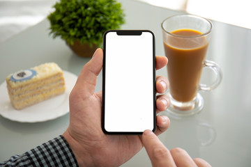 male hands holding phone with isolated screen in a cafe