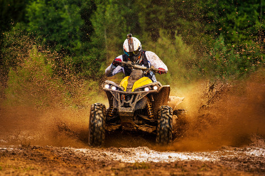 ATV rider in action on dirt track. Extreme ride. Baja