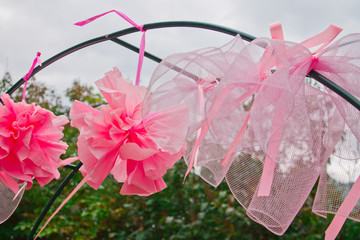 Arch with bows, decorative decoration in the garden