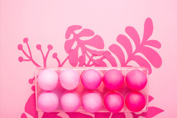 Easter 2019 with eggs painted in pink color on a monochrome background
