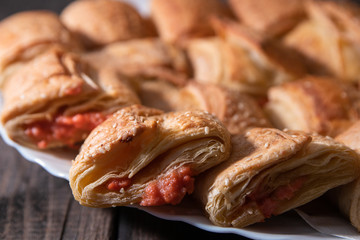 Homemade bannock from puff pastry with pizza filling