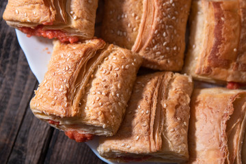 Homemade bannock from puff pastry with pizza filling