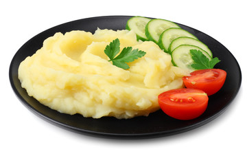 Mashed potatoes on black plate isolated on white background.
