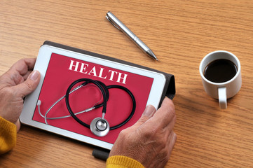 Someone consulting a health website with a tablet