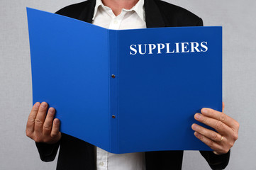 Man reading the suppliers file