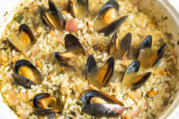 Rice with mussels, midopilafo in a pan - greek cuisine