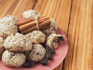 Homemade oatmeal cookies with dried fruits, nuts, chocolate and cinnamon