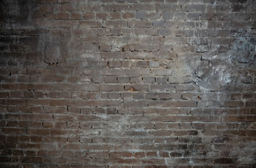 Background in the form of a brown brick wall with light seams