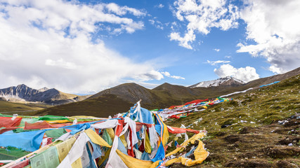 Colorful prayer flags at the Mila Mountain Pass (between the Lhasa Prefecture and the Nyingchi...