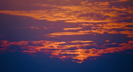 Beautiful sunrise image with colorful blue purple orange sky and white cloud with seascape landscape background