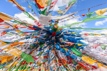 Colorful prayer flags at the Mila Mountain Pass (between the Lhasa Prefecture and the Nyingchi...