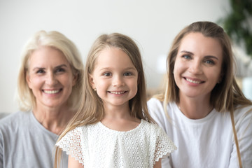 Head shot portrait grandmother, mother and daughter, three generations