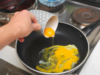 pouring the eggs into a pan