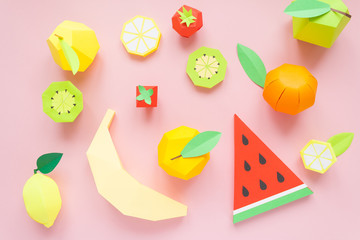 Fruit made of paper. Pink background. There's room for writing. Tropics. Flat lay.