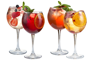 Cocktail with mint, fruits and berries on a white background. A set of four cocktails in glass glasses on a long leg.