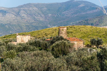 Fototapeta premium Old Abandoned Windmill, Chapel and other Building in the Mountains of Southern Italy